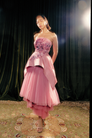 Hand painted sculpted peplum print and layered tulle skirt.