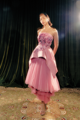 Hand painted sculpted peplum print and layered tulle skirt.