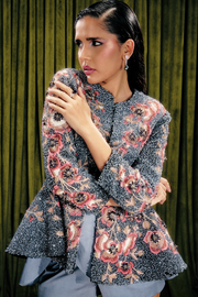Embellished peplum jacket paired with sculpted satin skorts